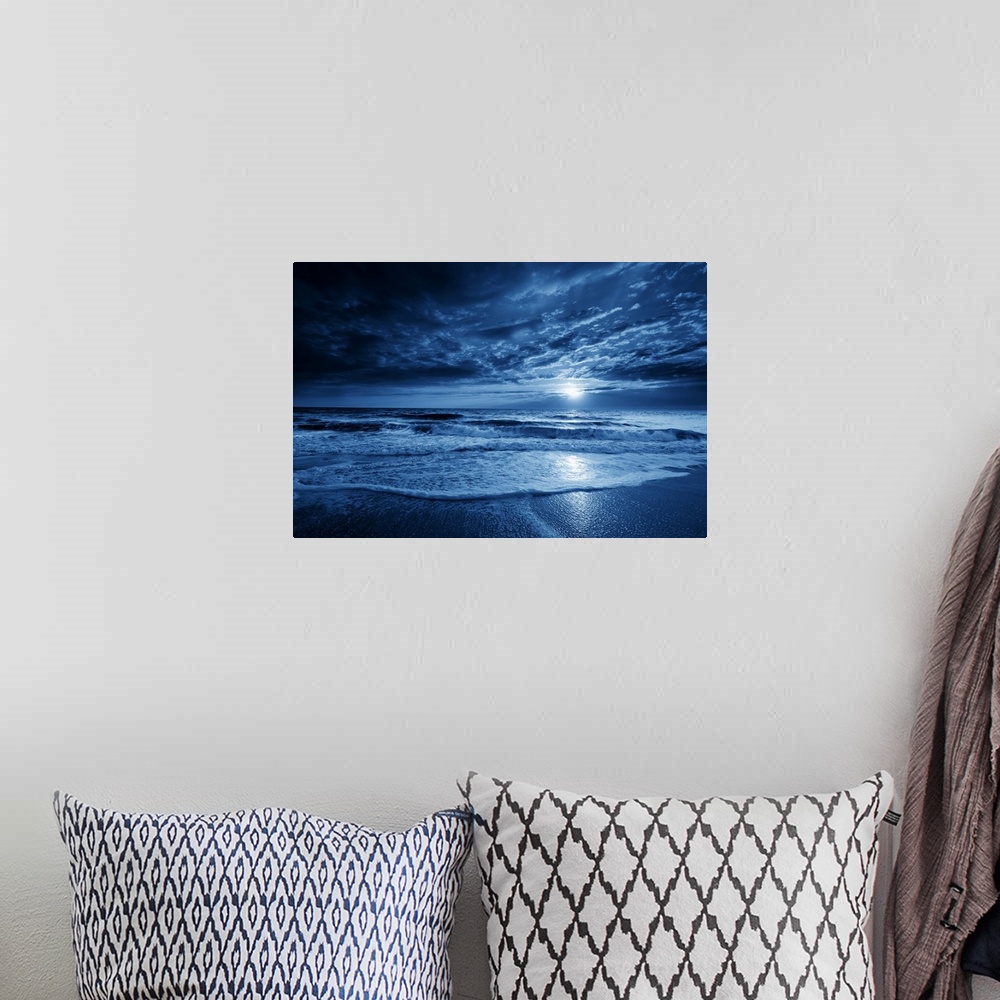A bohemian room featuring This is a photographic illustration of a beautiful midnight-blue ocean moonrise with dramatic sky...
