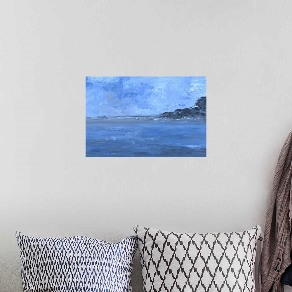 A bohemian room featuring Contemporary seascape painting of a rocky coast stretching into the ocean under a blue sky.