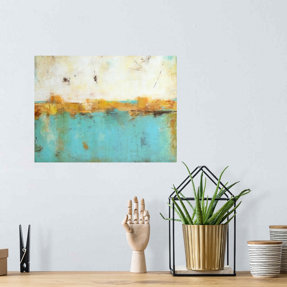 A bohemian room featuring A contemporary abstract painting that starts with a warm tone at the top and moves down to a cool...