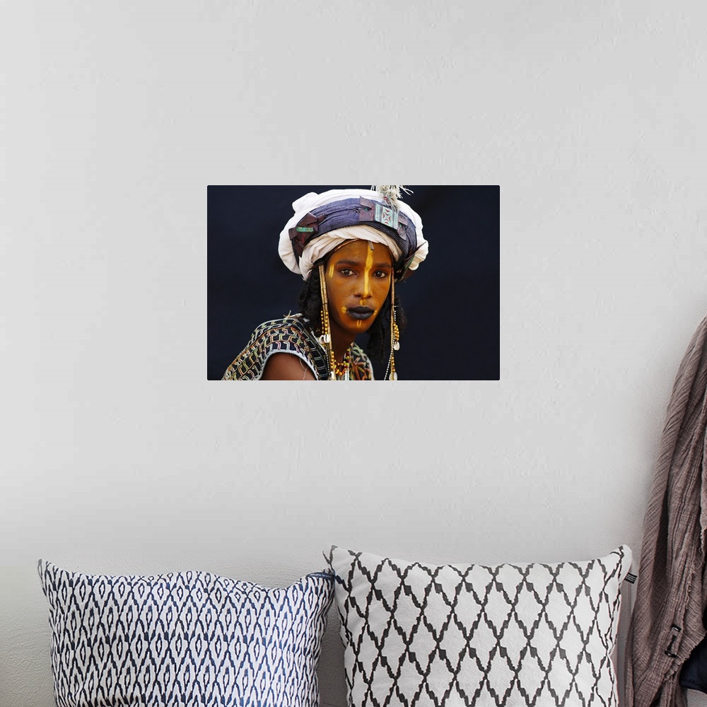 A bohemian room featuring Niger, A Wodaabe-Bororo boy with his face painted for the annual Gerewol male beauty contest