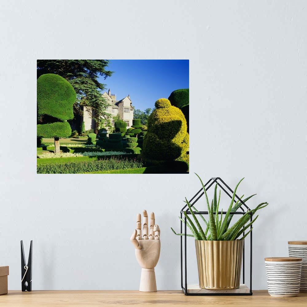 A bohemian room featuring England, Cumbria, Levens Hall Topiary Gardens, the famous gardens near Kendal town