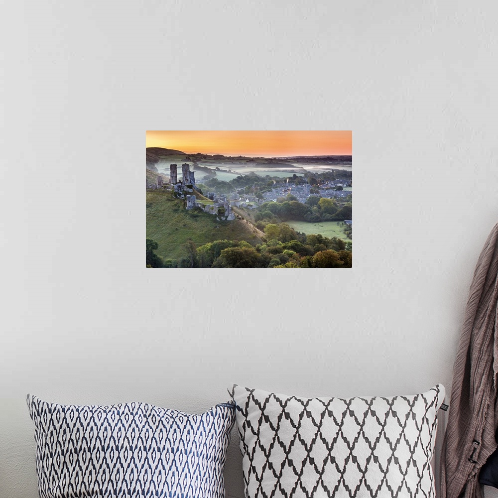 A bohemian room featuring UK, England, Great Britain, Dorset, Sunrise over Corfe Castle in Purbeck Island.