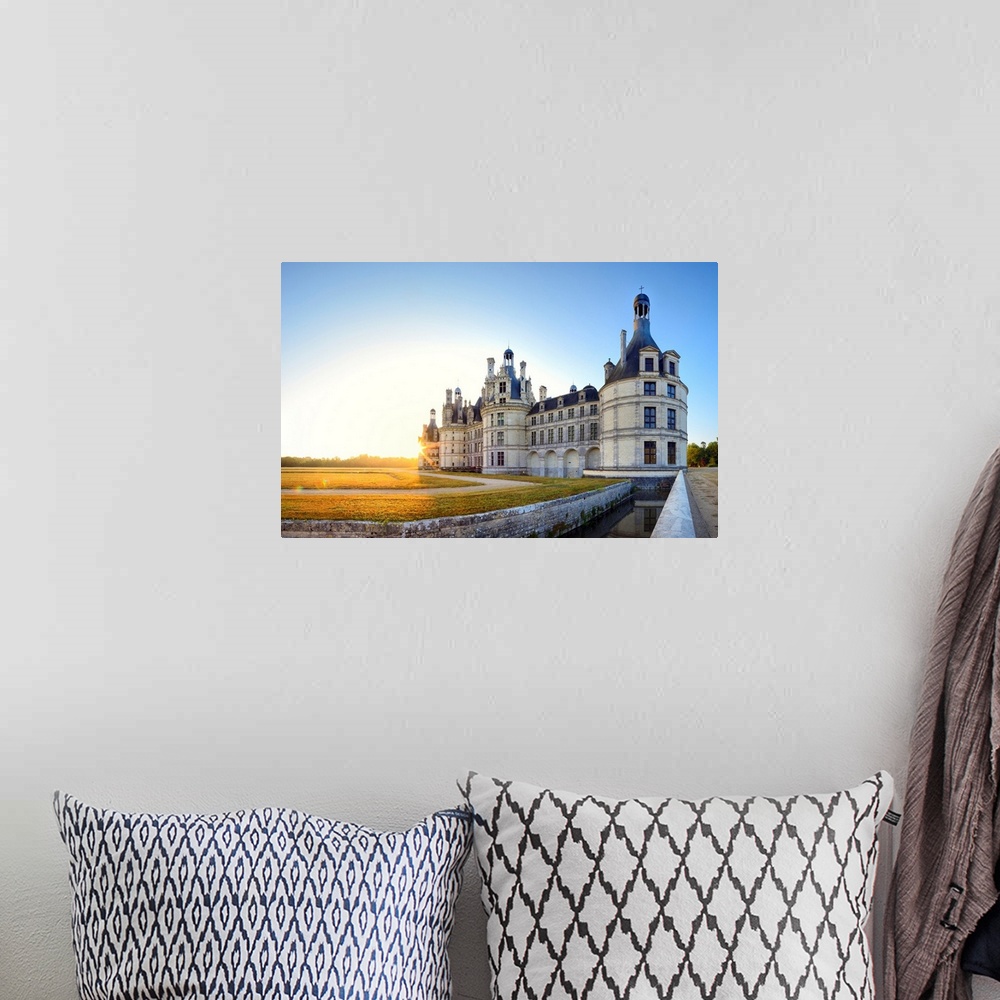 A bohemian room featuring France, Centre, Chambord Castle, sunrise behind Chambord castle.
