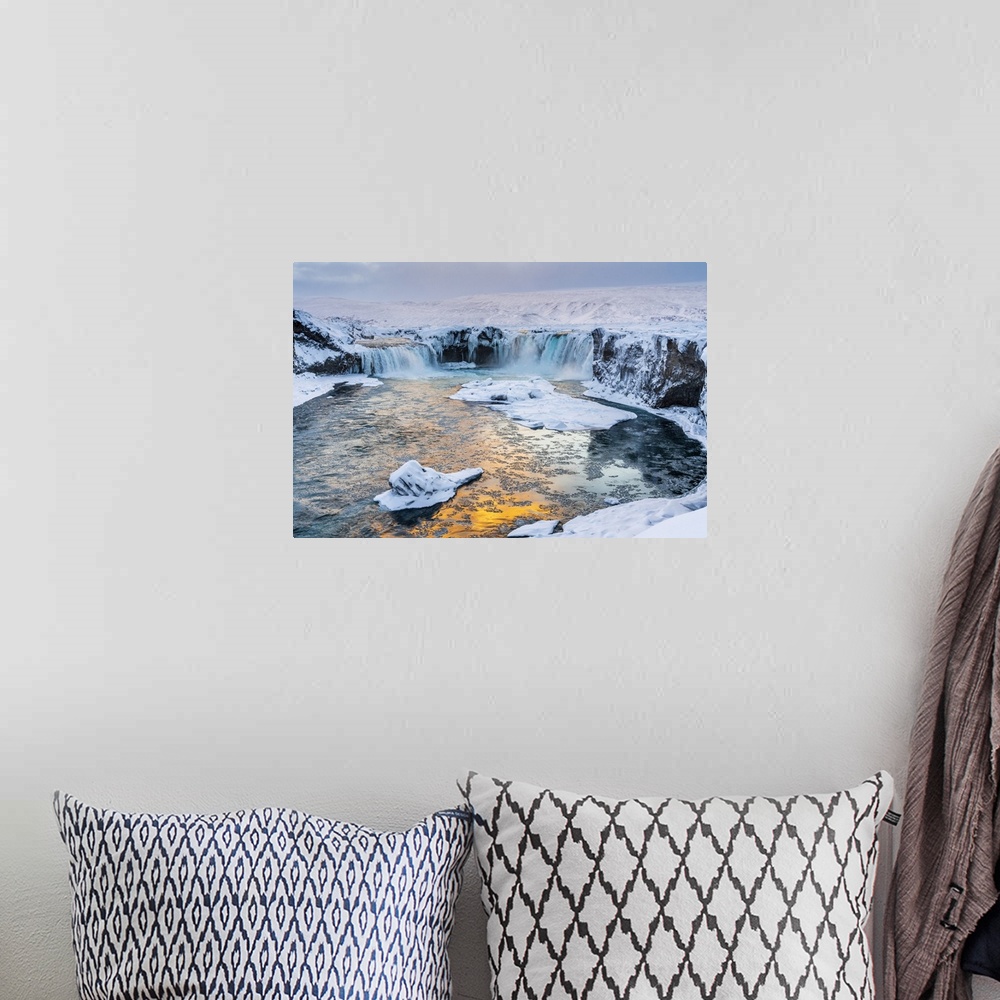 A bohemian room featuring Iceland, Northeast Iceland, Sunset over a snow-covered Godafoss.
