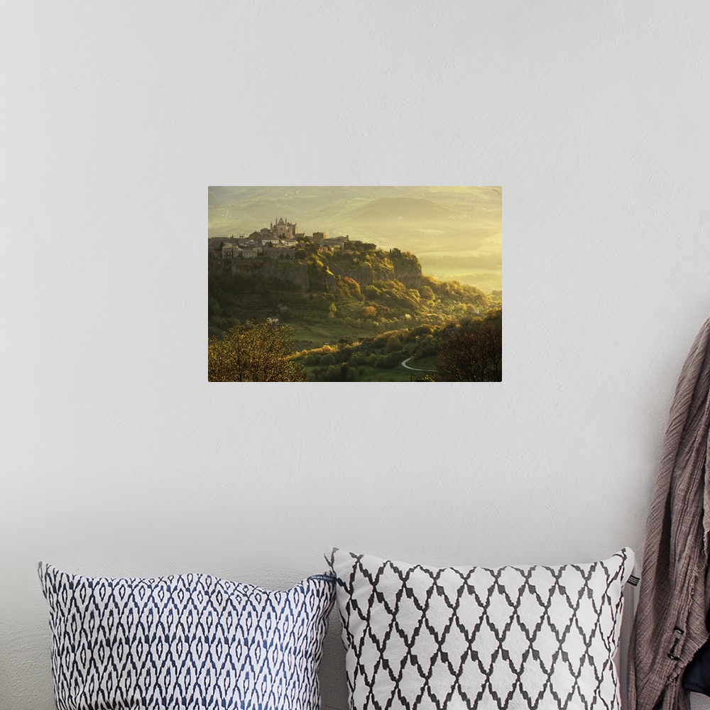 A bohemian room featuring Italy, Umbria, Terni district, Orvieto, Cathedral and the surrounding area at sunrise.