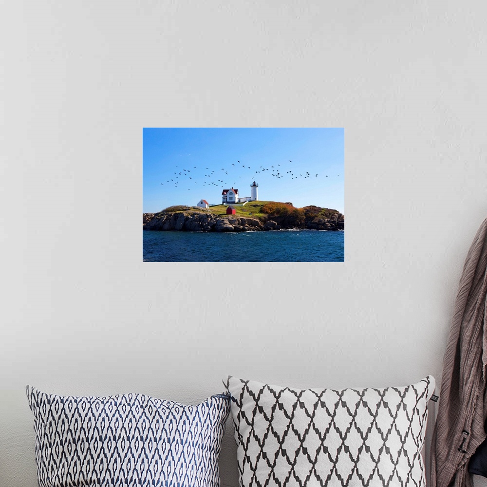 A bohemian room featuring USA, Maine, Cape Neddick, New England, Atlantic, Nubble Lighthouse on the Savage Rock with a floc...