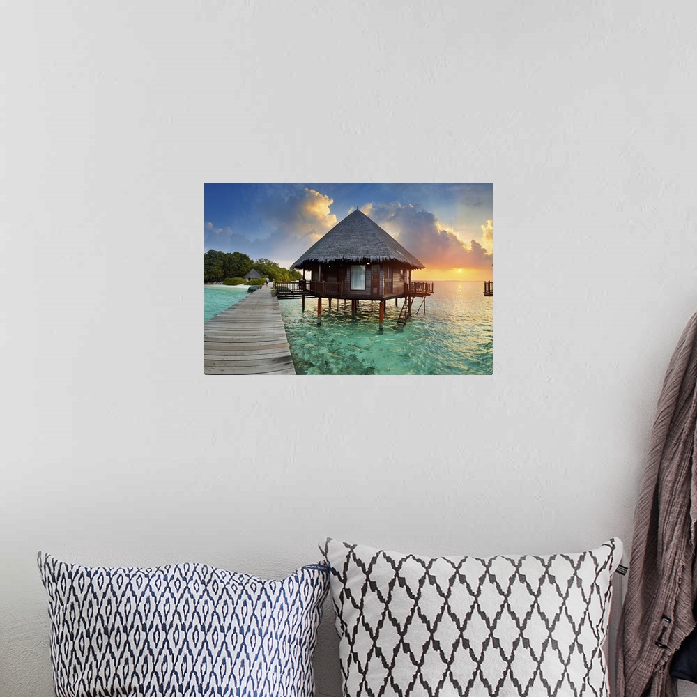 A bohemian room featuring Maldives, Velidhu, Ari Atoll at sunset.