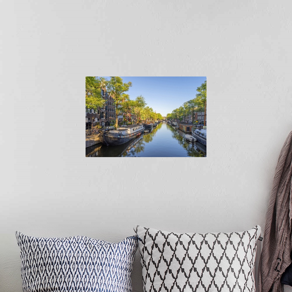 A bohemian room featuring Netherlands, North Holland, Amsterdam, Prinsengracht, Benelux, Prinsengracht in the evening.