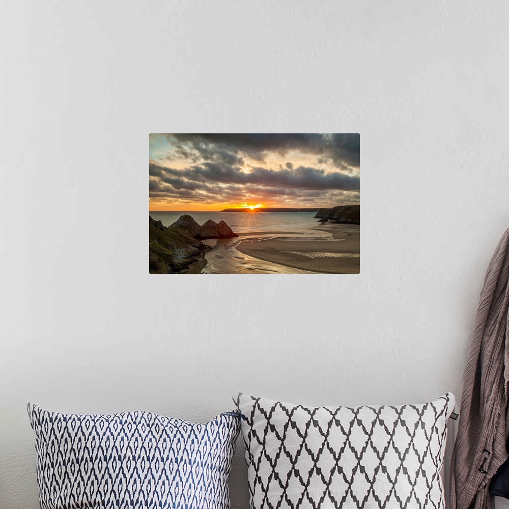 A bohemian room featuring UK, Wales, Gower Peninsula, Great Britain, Three Cliffs Bay at sunset.