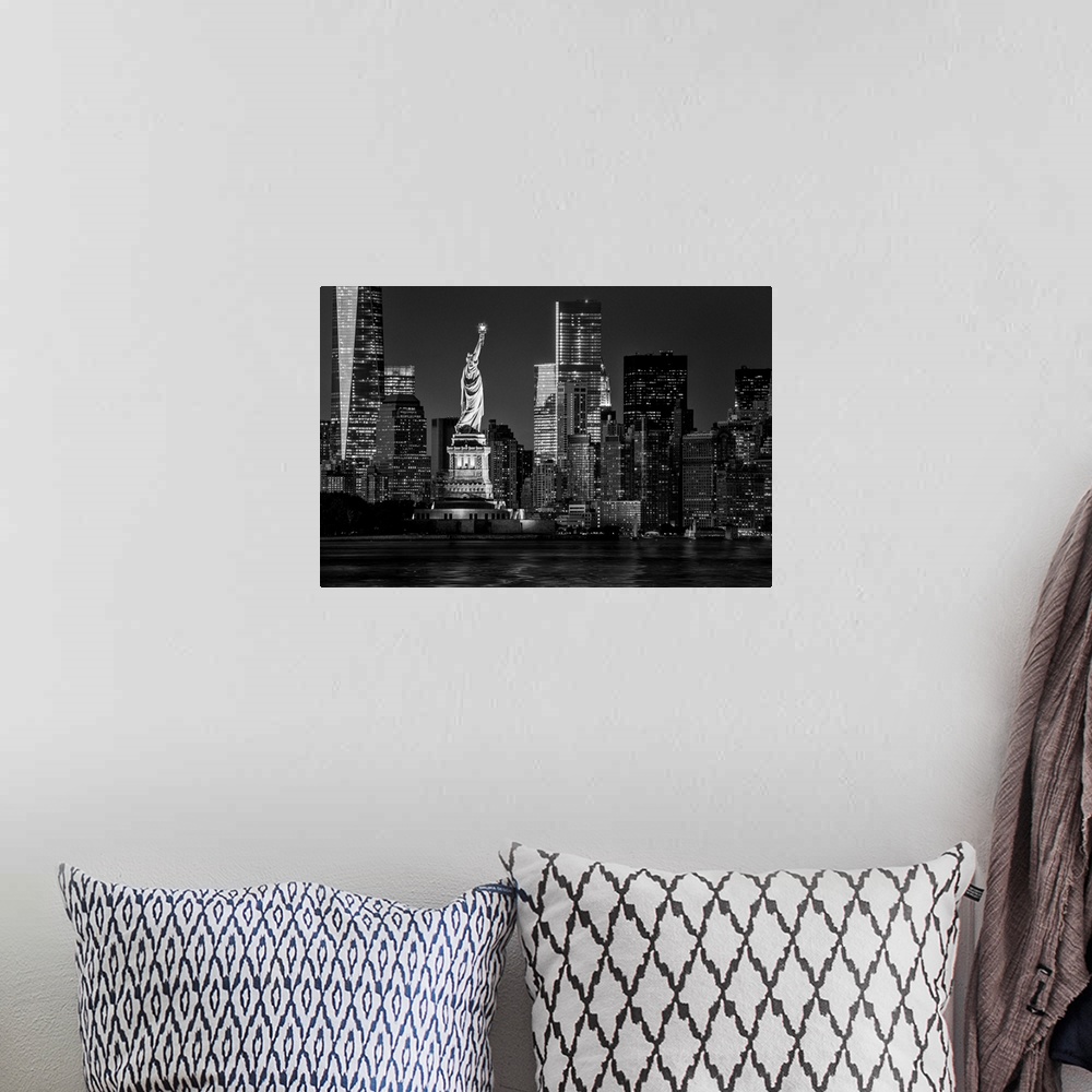 A bohemian room featuring USA, New York City, Lower Manhattan, Lower Manhattan skyline and Statue of Liberty at night.