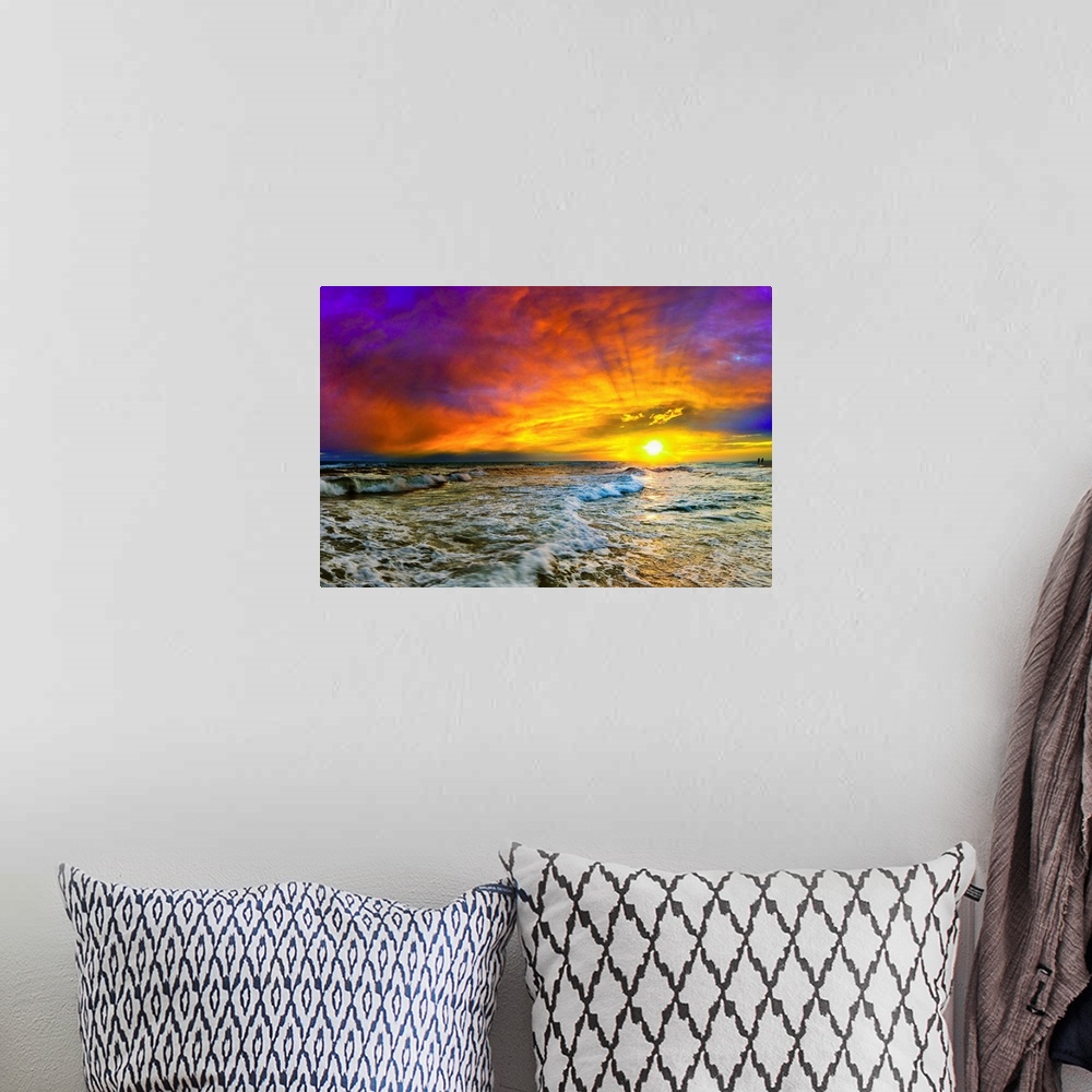 A bohemian room featuring A beautiful purple, blue, and red sunset with shooting sun rays over the ocean. The yellow sun ca...