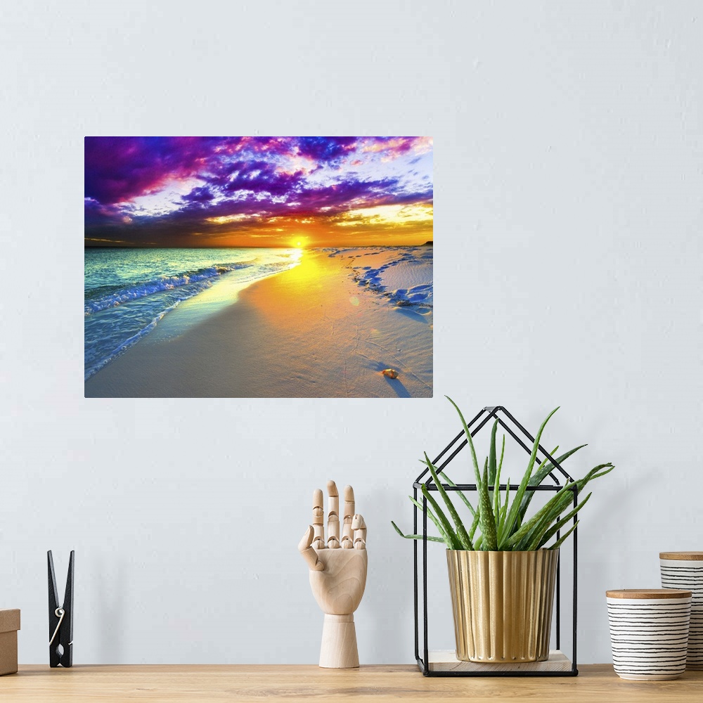 A bohemian room featuring A beautiful purple and blue sunset over a sandy beach shoreline. The ocean takes up a small part ...