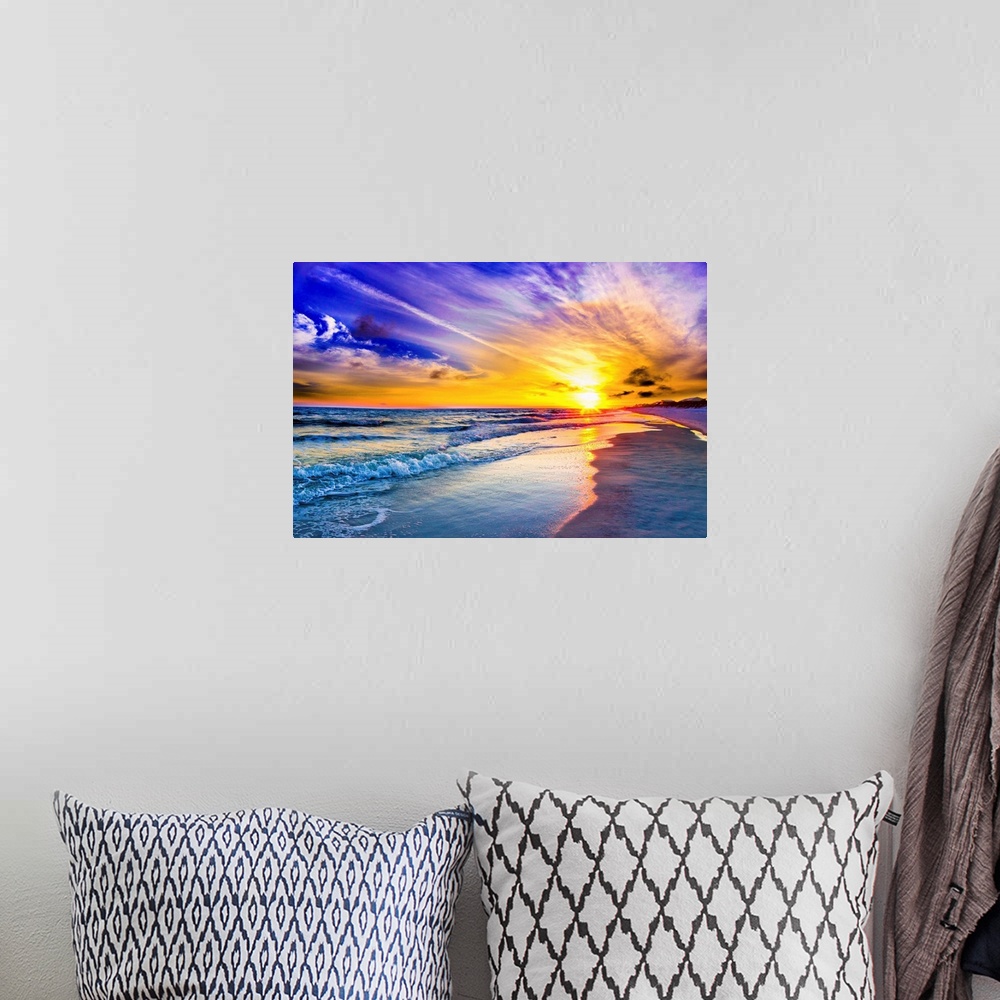 A bohemian room featuring An amazing sunset with pink and purple sky and clouds. A blue seascape and beach below.