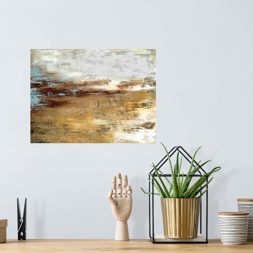 A bohemian room featuring Abstract contemporary painting in gold and grey, resembling a landscape at sunset.