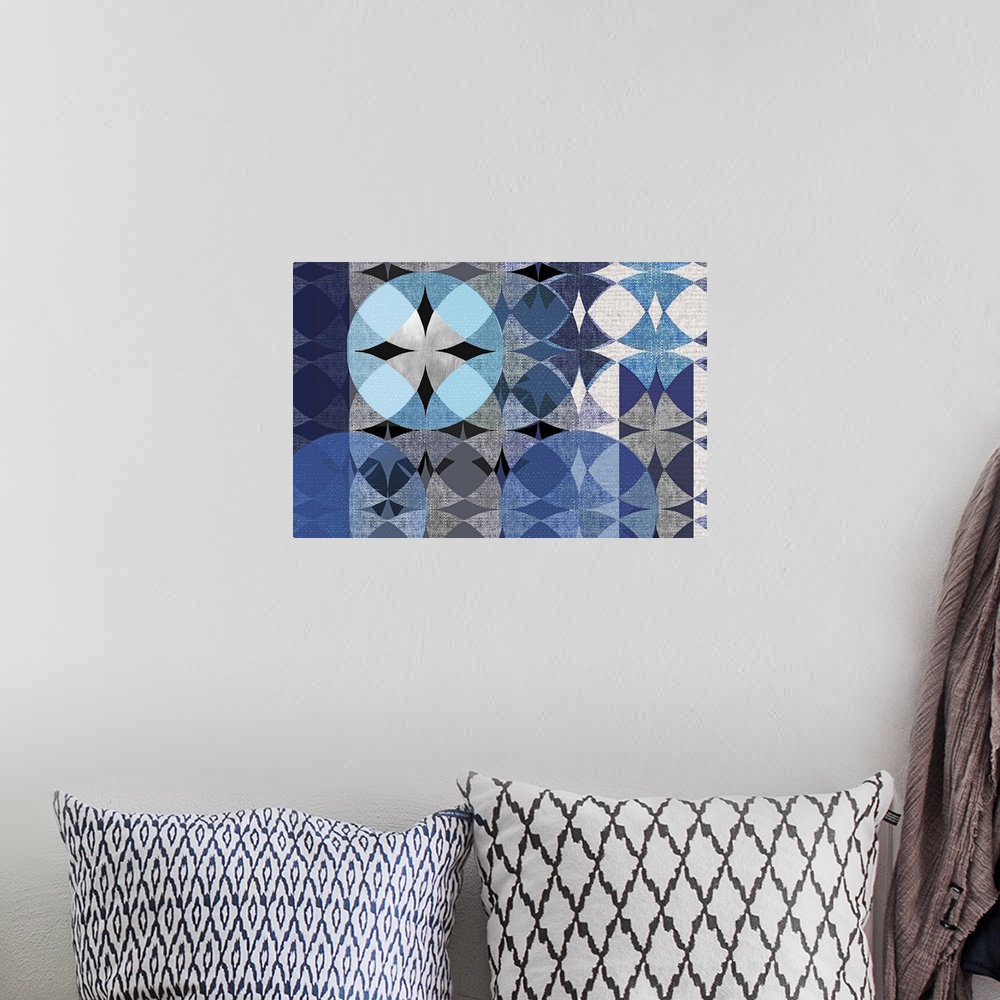 A bohemian room featuring Abstract art with overlapping and repeating shapes and designs in shades of blue and grey resembl...