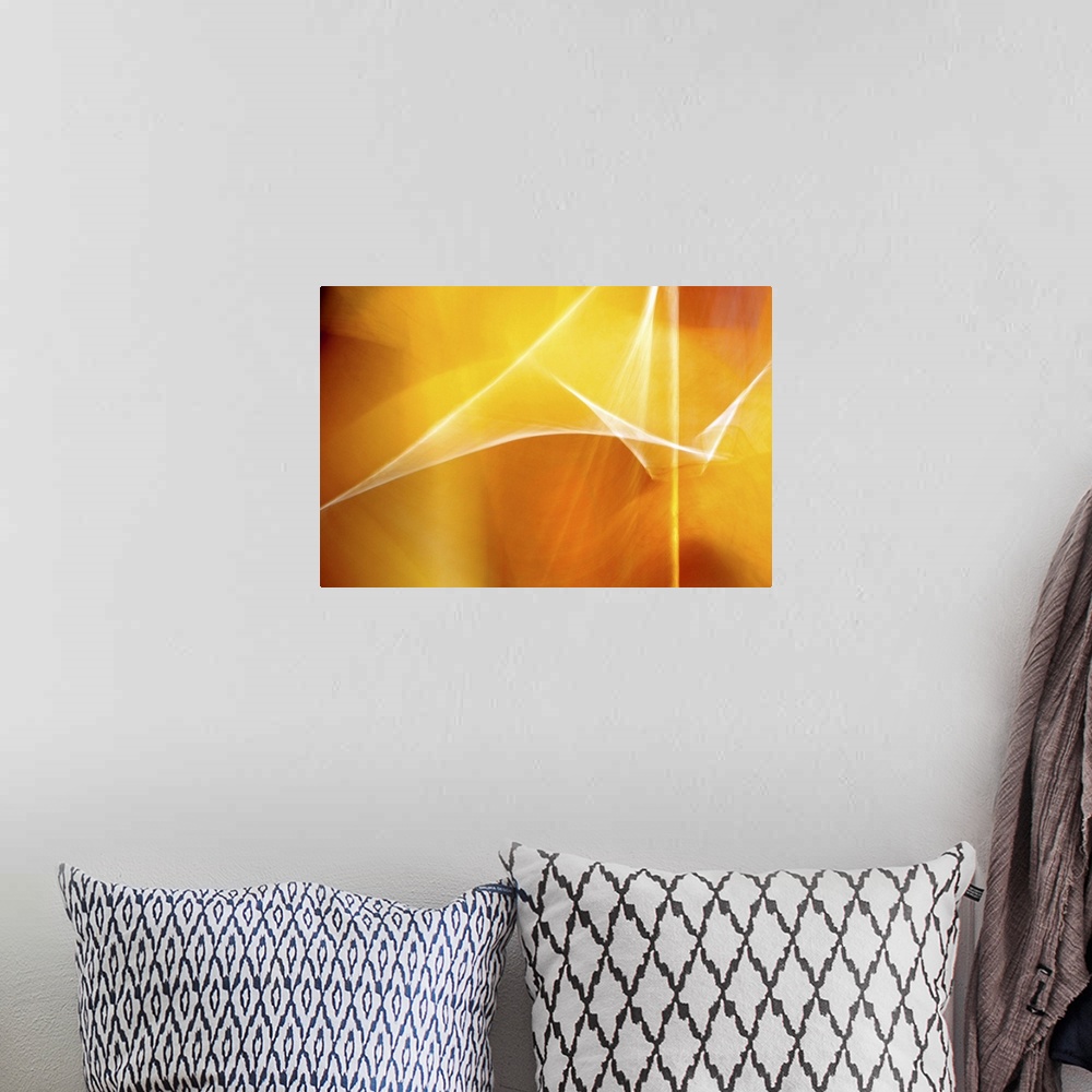A bohemian room featuring Digital abstract art in bright shades of yellow and orange.