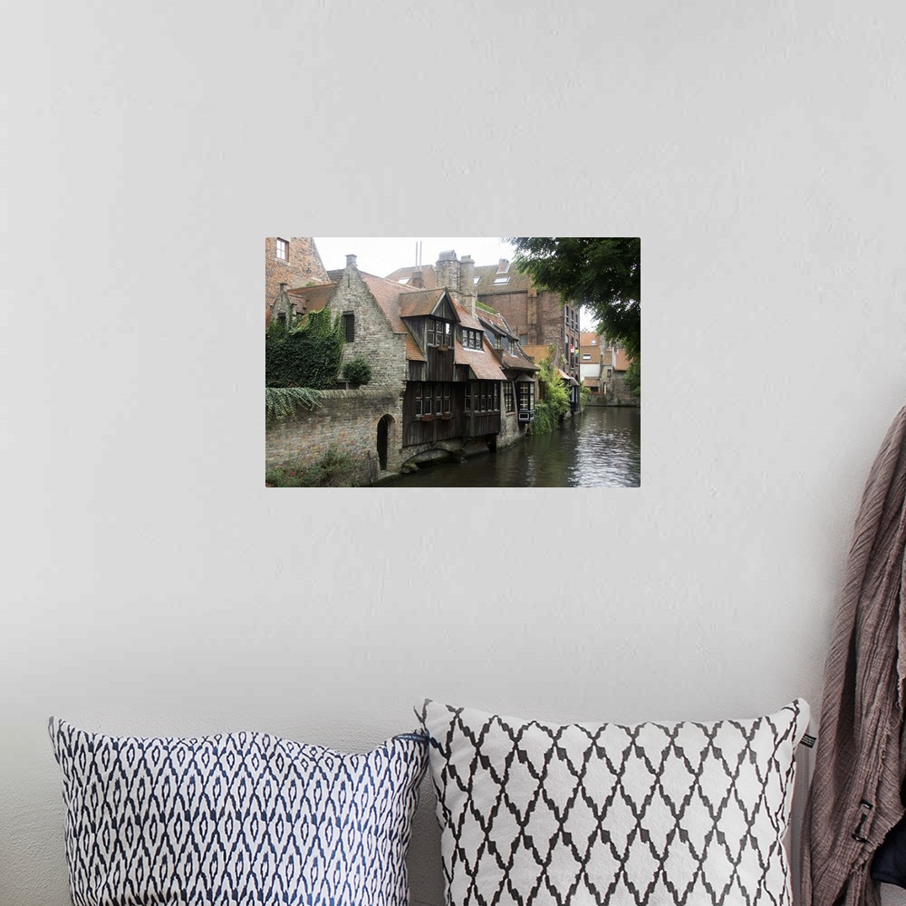 A bohemian room featuring Photograph of old houses on the edge of the river in Belgium.
