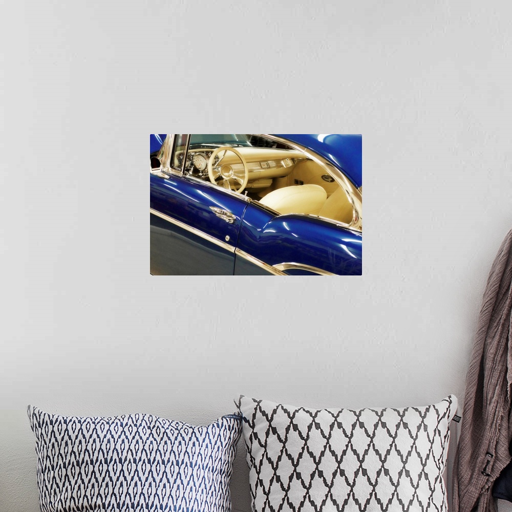A bohemian room featuring This horizontal photograph is a close up of the interior of an antique car.