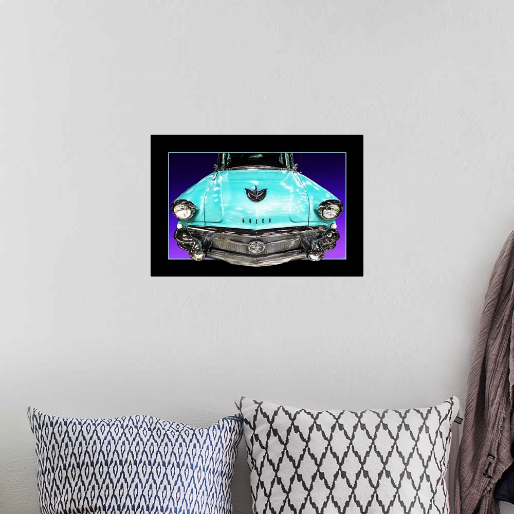 A bohemian room featuring The headlights and grill of a teal blue muscle car with a faux black border.