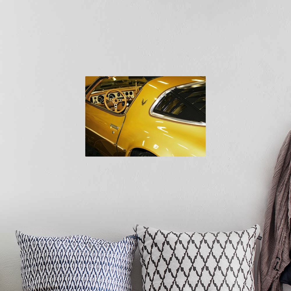 A bohemian room featuring Fine art photograph of a vintage car. The interior and steering wheel are visible.