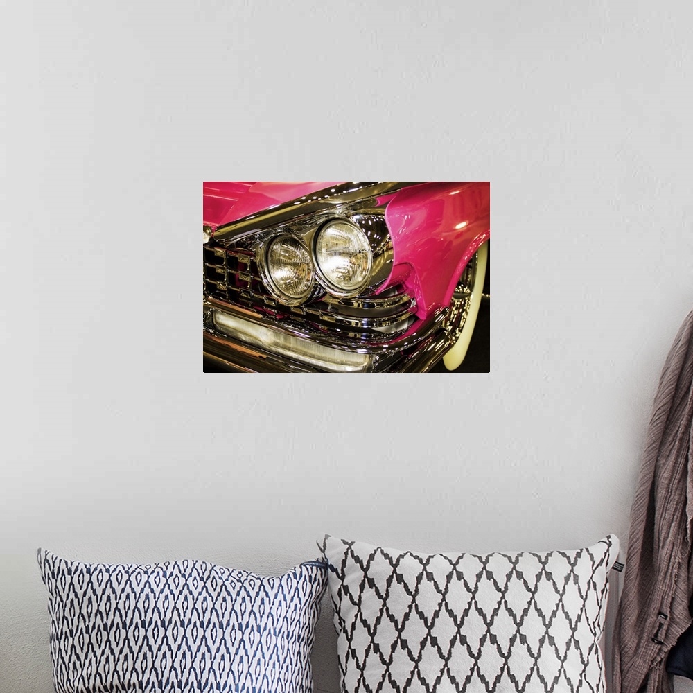 A bohemian room featuring Fine art photograph of the headlights of a hot pink vintage car.