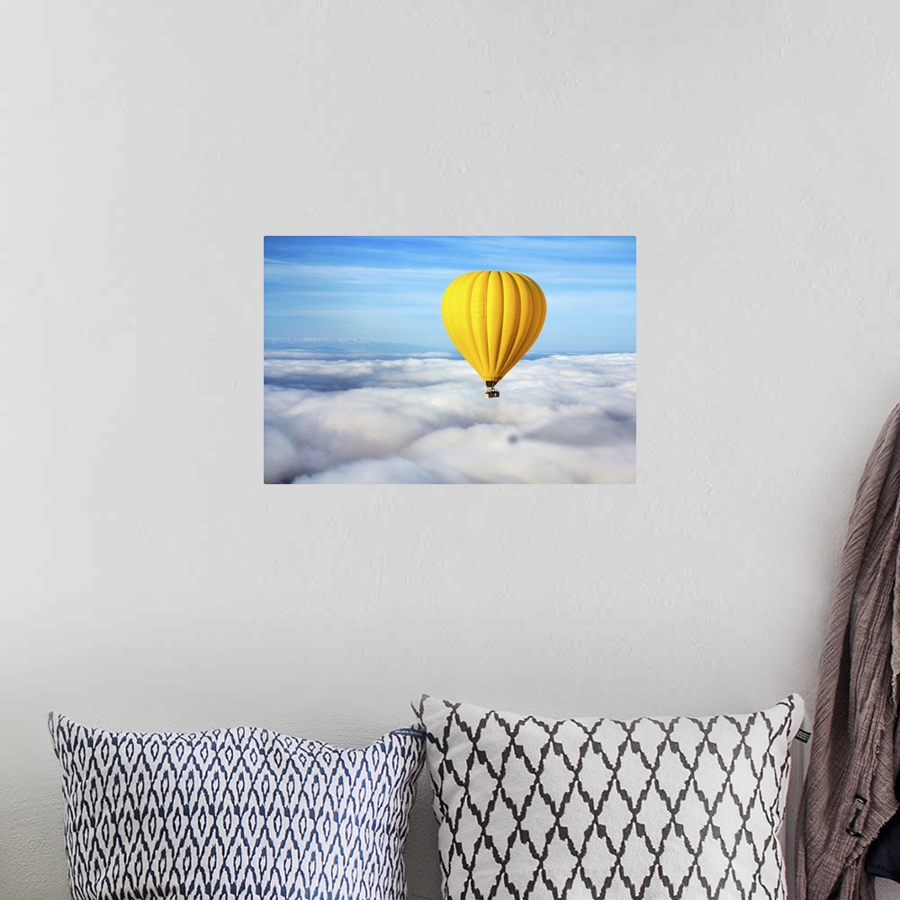 A bohemian room featuring A Lonely Yellow Hot Air Balloon Floats Above The Clouds