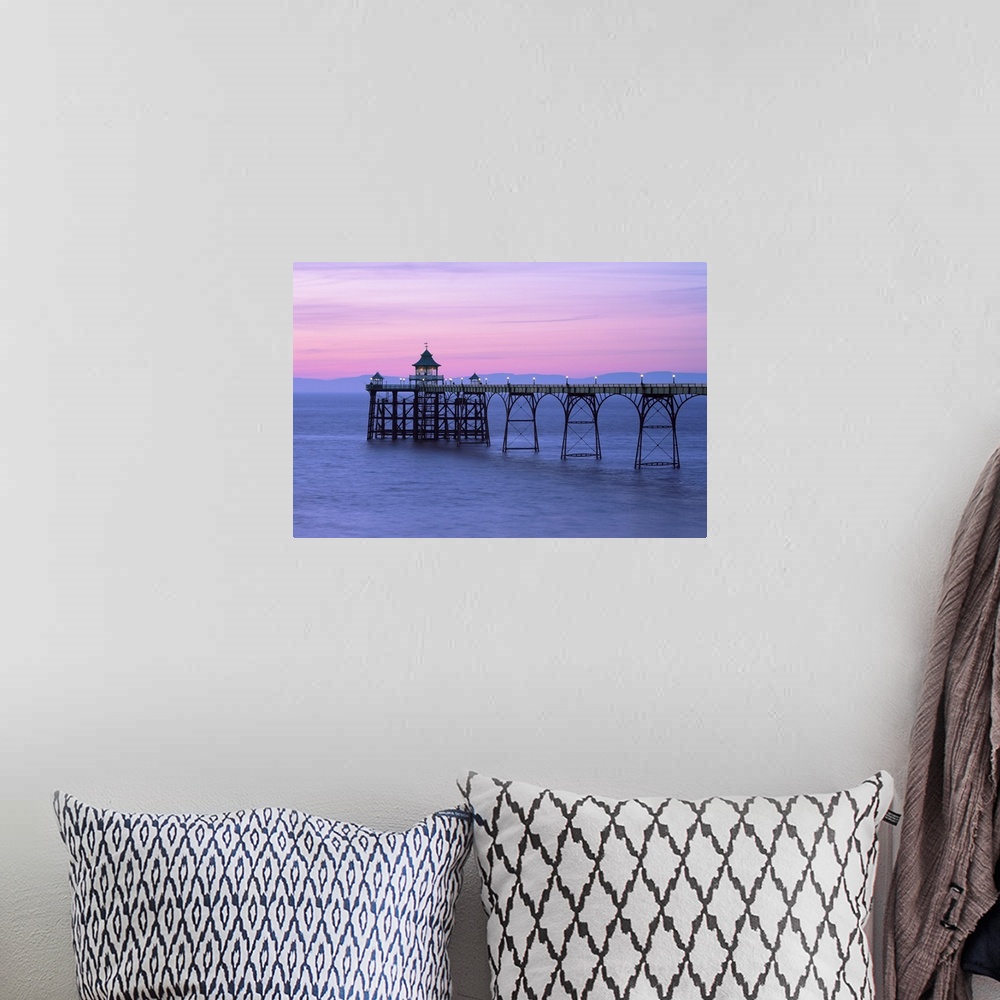 A bohemian room featuring A pink dusk sky over Clevedon Pier in Somerset.