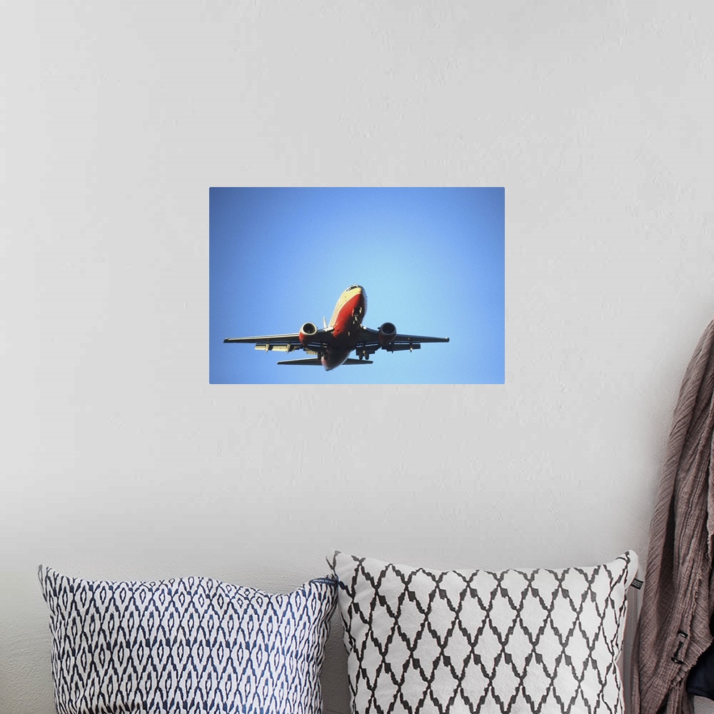 A bohemian room featuring Aeroplane flying across blue sky