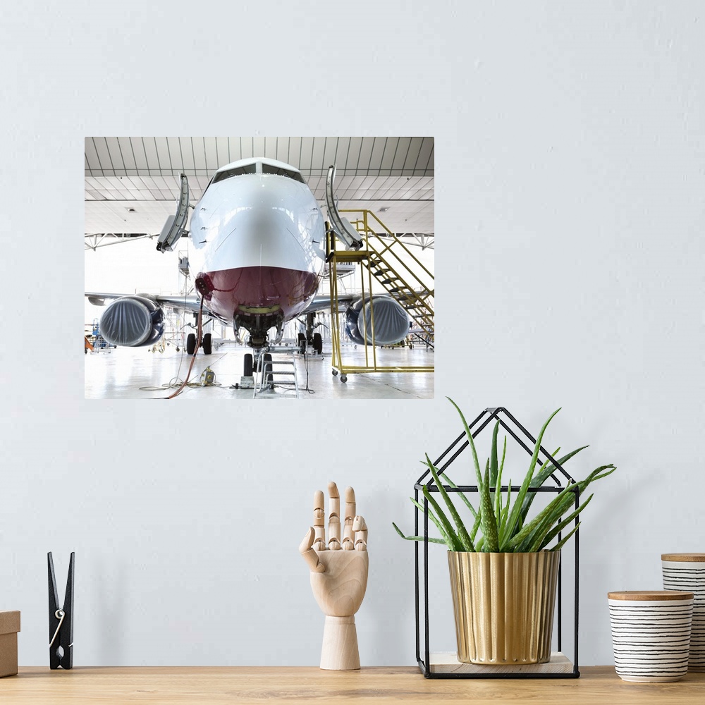 A bohemian room featuring Airplane docked in hangar