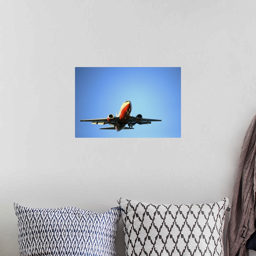A bohemian room featuring airplane in blue sky
