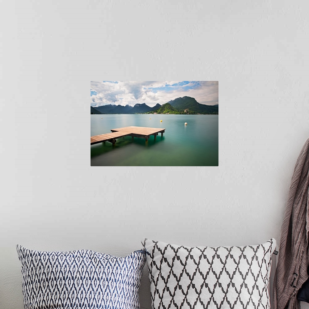 A bohemian room featuring Annecy lake and French Alps in background.