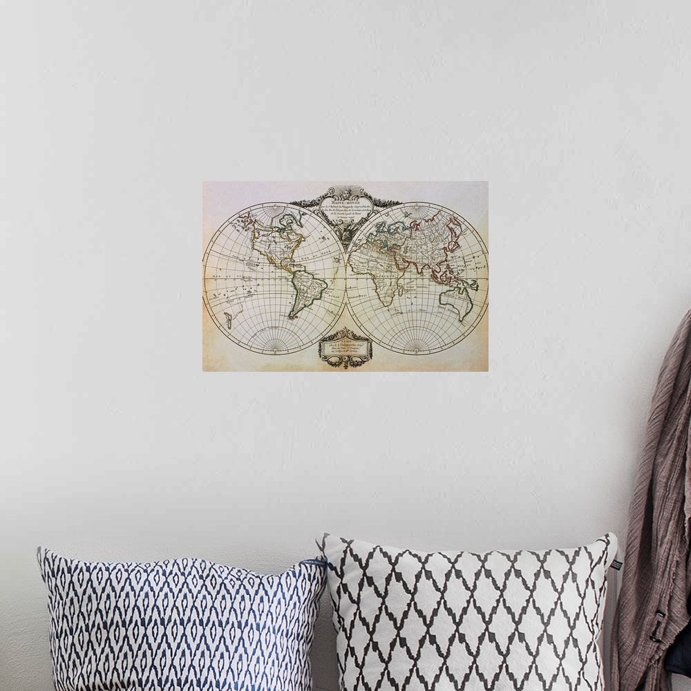 A bohemian room featuring An antique map of the world showing one half in a circle and the other half in another circle jus...