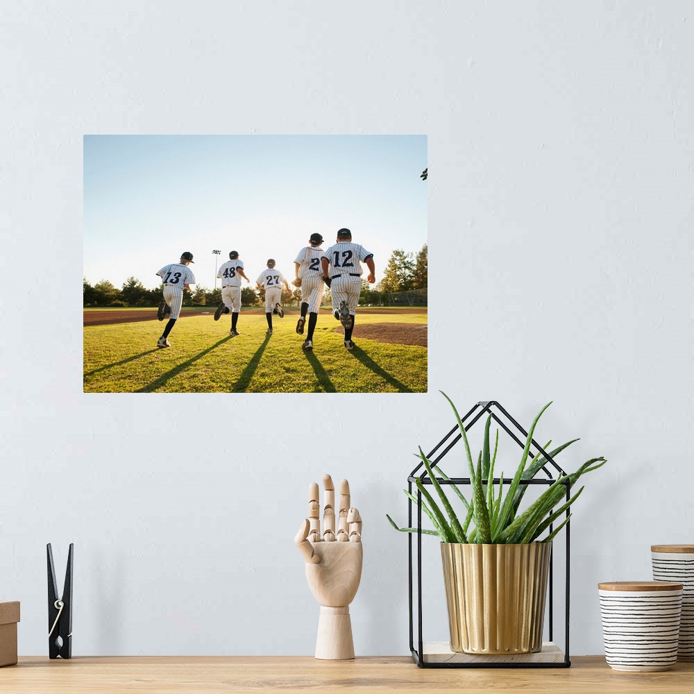 A bohemian room featuring Baseball players (10-11) running on baseball diamond
