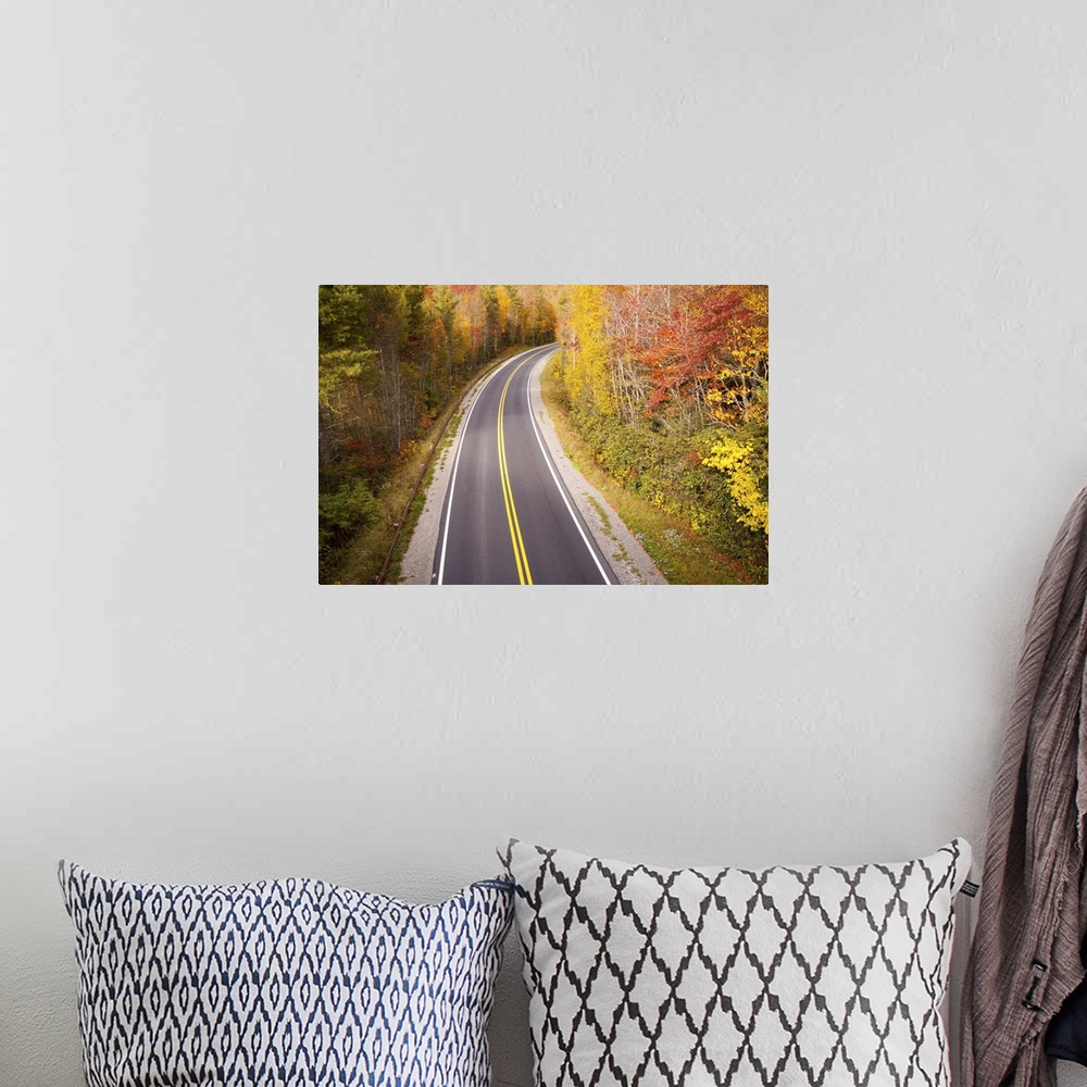 A bohemian room featuring Beautiful curvy road located in Blue Ridge Parkway, North Carolina during fall season.