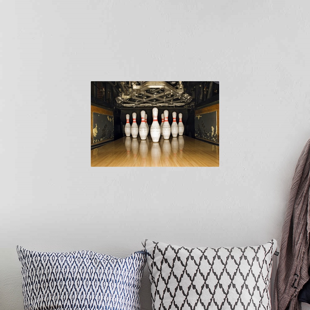 A bohemian room featuring Bowling pins and machine