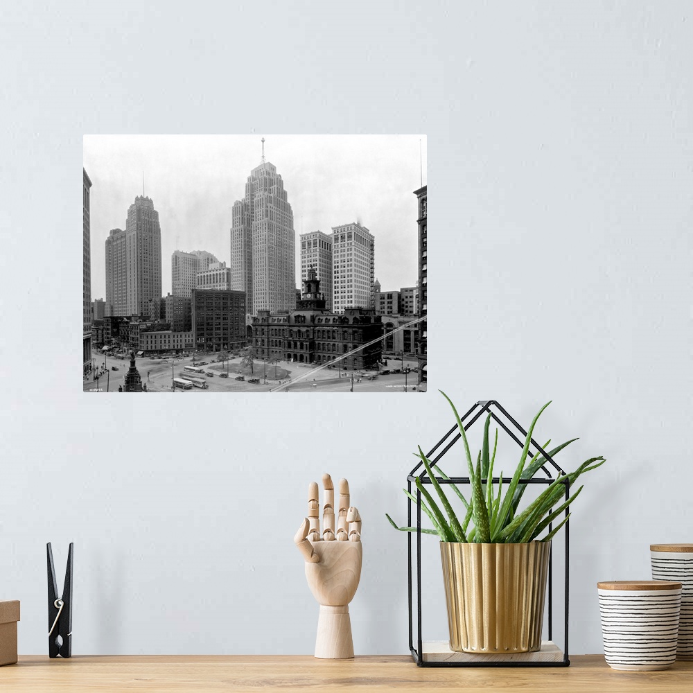 A bohemian room featuring The Guardian Building (tall tower on l) and the Penobscot Building (tall tower on r) tower over a...