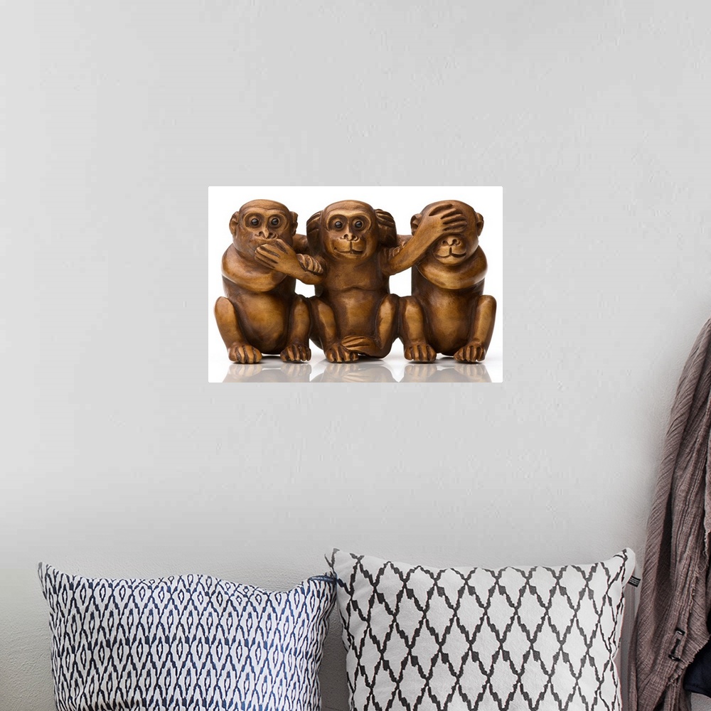 A bohemian room featuring Carving of three wooden monkeys