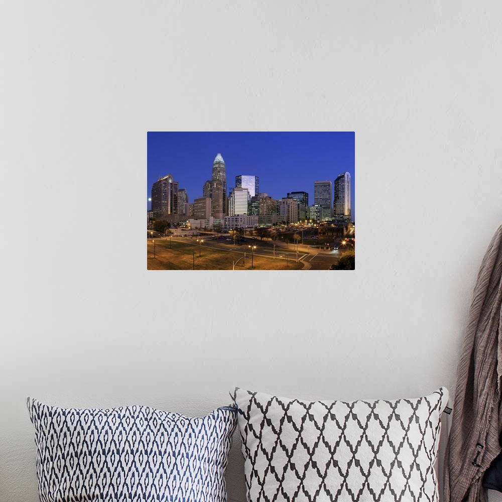 A bohemian room featuring Downtown Charlotte, North Carolina skyline at night