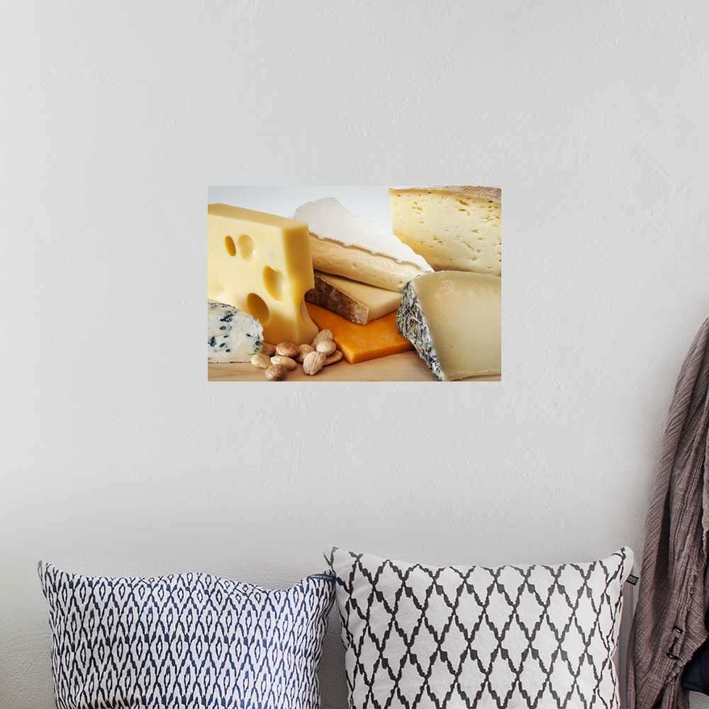 A bohemian room featuring Various cheeses on chopping board