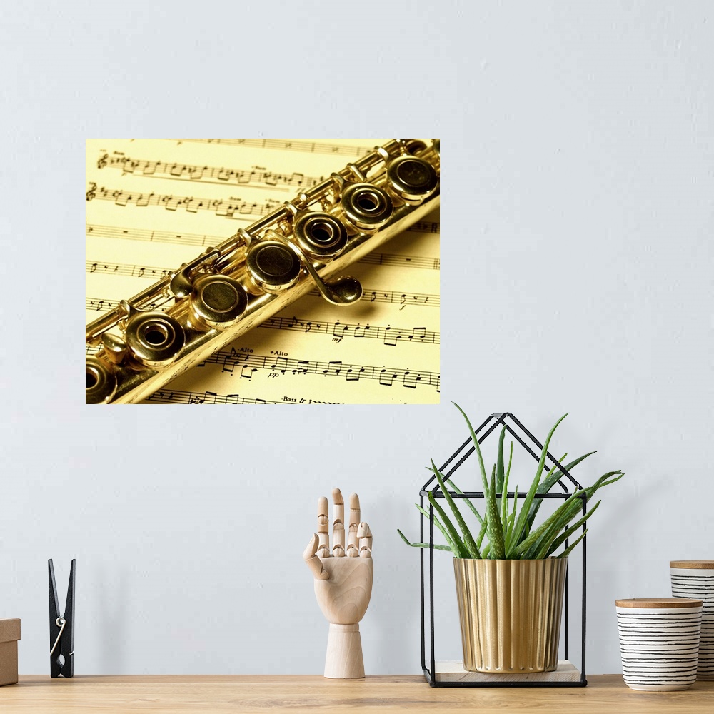 A bohemian room featuring Close-up of a flute on a sheet music