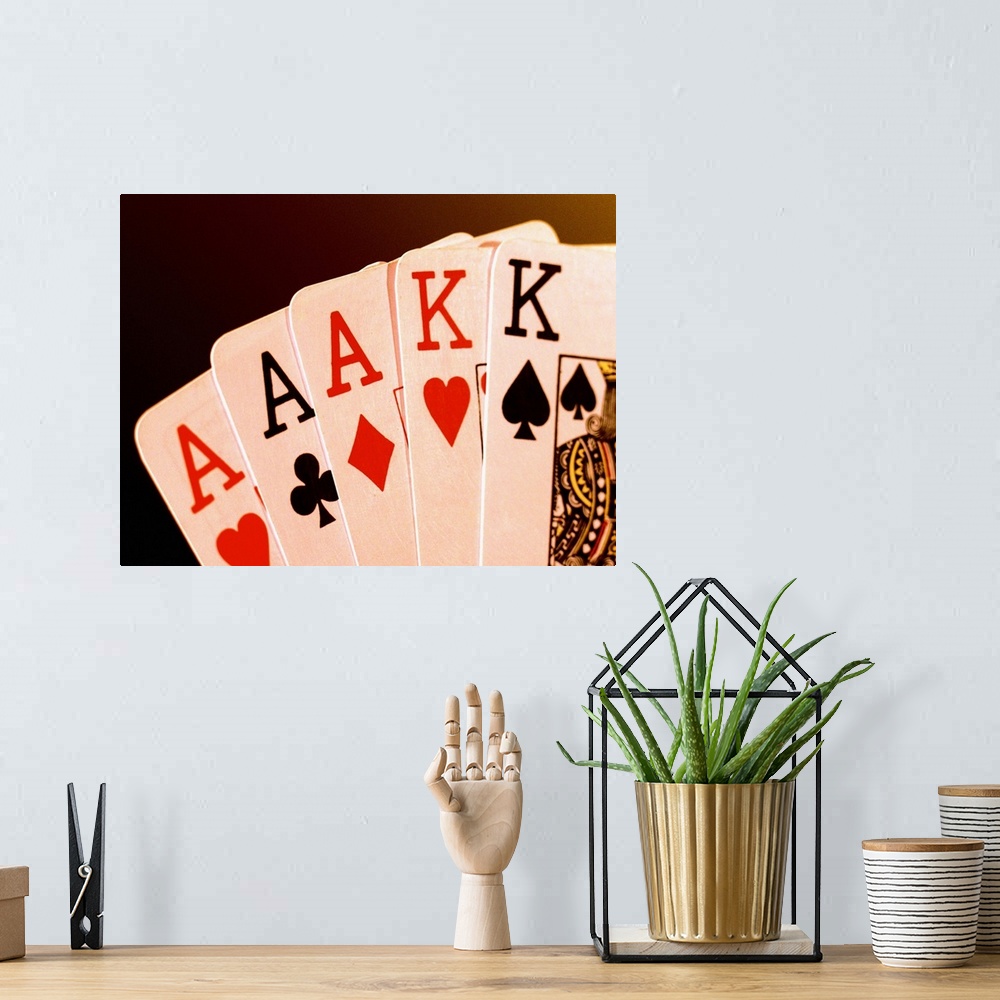 A bohemian room featuring Close-up of a hand of aces