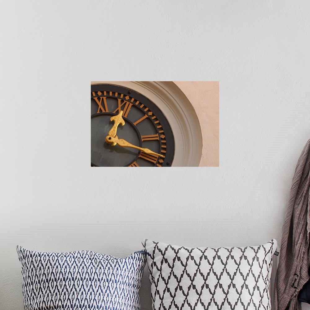 A bohemian room featuring Landscape, large, close up photograph of a partial clock on a tower.  The large golden hands of t...