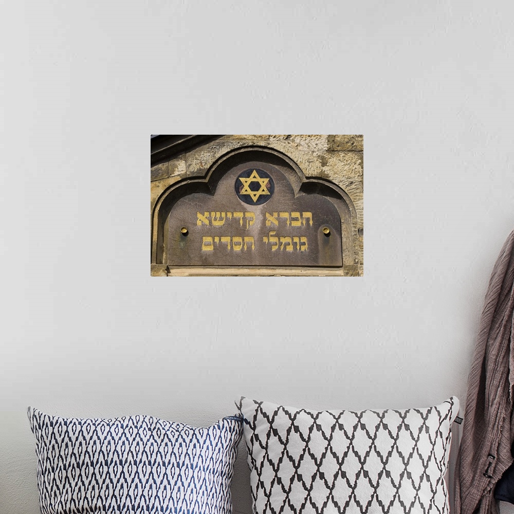 A bohemian room featuring Close up of old synagogue sign