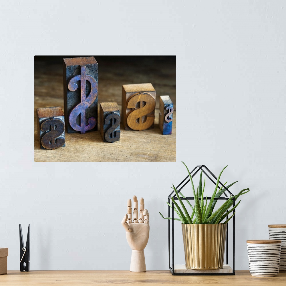 A bohemian room featuring Close up of printing blocks with dollar sign on wood