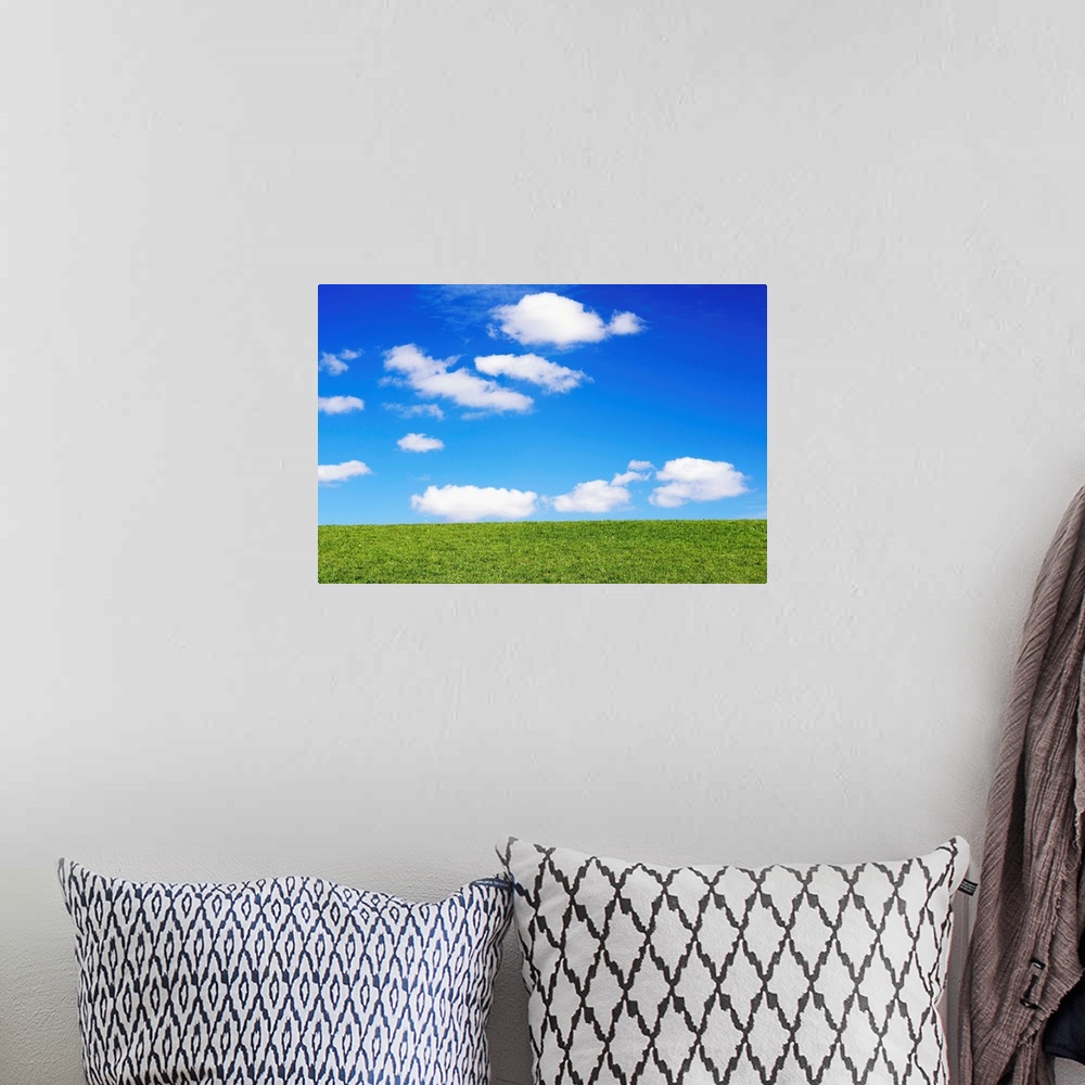A bohemian room featuring Clouds In Blue Sky Over Green Grass