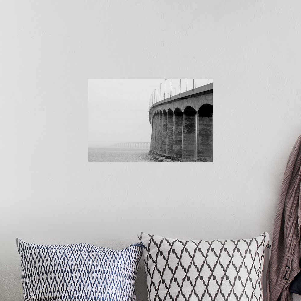 A bohemian room featuring Confederation bridge, Prince Edward Island and New Brunswick on a cloudy foggy day.
