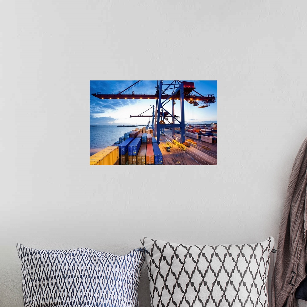 A bohemian room featuring Container terminal at dusk, view from cargo ship
