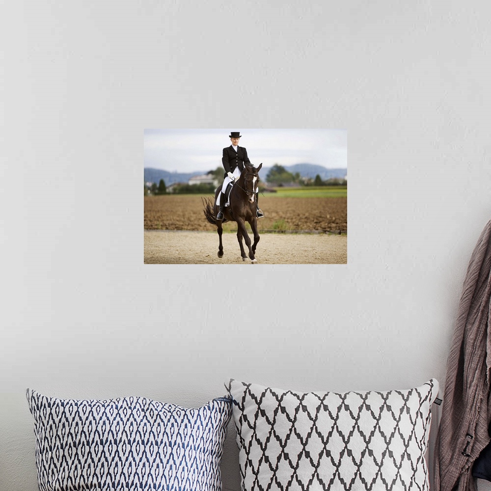A bohemian room featuring Female dressage rider exercising