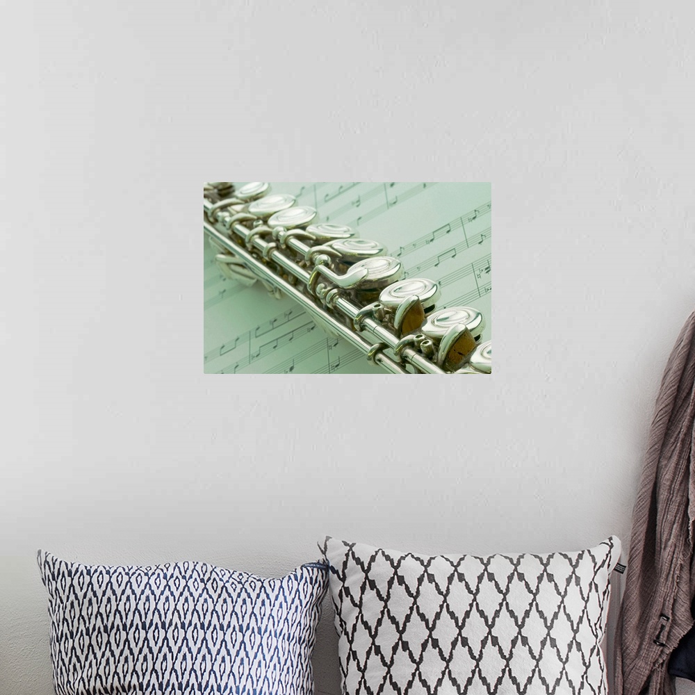 A bohemian room featuring Flute over sheet music