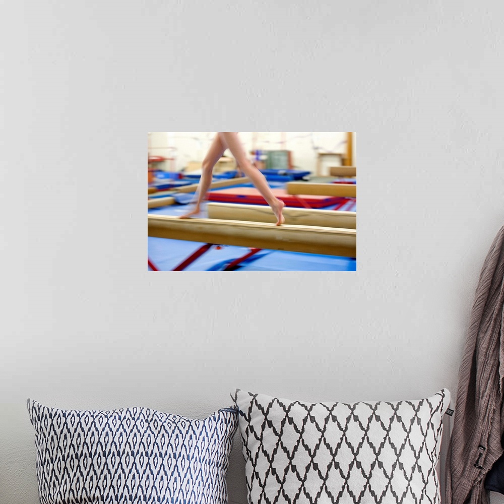 A bohemian room featuring Girl (16-17) running on balance beam, low section (blurred motion)